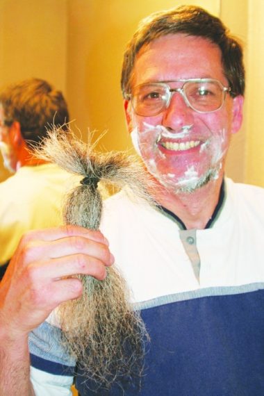 Middle school teacher Gary Weddle, 50, East Wenatchee, displays his cut beard while shaving the remaining stubble the evening of May 1. He completed a vow made nearly 10 years ago not to shave until Osama bin Laden was captured or proven killed.