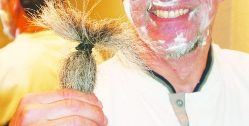 Middle school teacher Gary Weddle, 50, East Wenatchee, displays his cut beard while shaving the remaining stubble the evening of May 1. He completed a vow made nearly 10 years ago not to shave until Osama bin Laden was captured or proven killed.