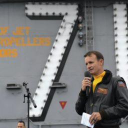 Capt. Brett Crozier, then-commanding officer of the aircraft carrier USS Theodore Roosevelt (CVN-71), addresses the crew during an all-hands call on the ship’s flight deck on Nov. 15, 2019. US Navy Photo