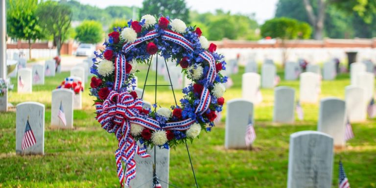 Fort Benning honors the nation's fallen service members with a Memorial Day ceremony at the post's cemetery May 27. The 9 a.m. ceremony at the Main Post Cemetery went forward under bright but partly cloudy skies, with an audience of some 200 Soldiers and civilians seated outdoors. The ceremony included remarks by a speaker, and a wreath-laying in tribute to "all the nation's veterans who made the ultimate sacrifice." The wreath-laying was followed by the firing of a three-volley rifle salute and the playing of "Taps." (U.S. Army photos by Patrick Albright, Maneuver Center of Excellence, Fort Benning Public Affairs)