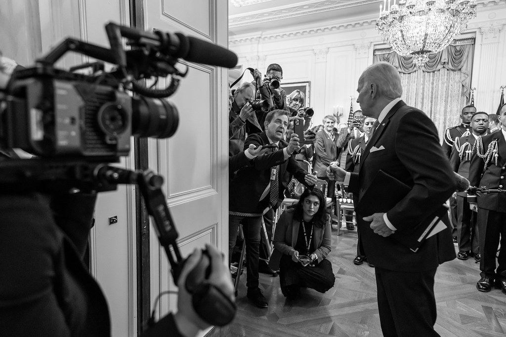 President Joe Biden talks to reporters as he departs an event with attendees from the U.S. Conference of Mayors Winter Meeting, Friday, January 20, 2023, in the East Room of the White House.