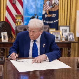 President Trump signing Oval Office February 12, 2025