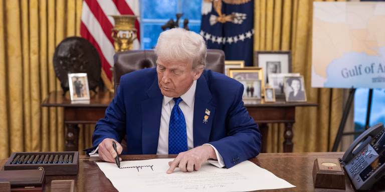 President Trump signing Oval Office February 12, 2025