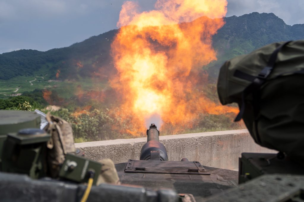 An M1A2 SEP v2 Abrams assigned to Bravo Company, 4th Battalion, 70th Armored Regiment, 1st Armored Brigade Combat Team, 1st Armored Division, fires at a target during a zero range at Rodriguez Live-Fire Complex, South Korea, Aug. 5, 2024. The unit is participating in a deployment readiness exercise in support of Operation Pacific Fortitude, which supports long-standing agreements to the Republic of Korea by deploying forces, drawing and transporting equipment to validate unit readiness and the U.S. commitment to the alliance.