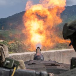 An M1A2 SEP v2 Abrams assigned to Bravo Company, 4th Battalion, 70th Armored Regiment, 1st Armored Brigade Combat Team, 1st Armored Division, fires at a target during a zero range at Rodriguez Live-Fire Complex, South Korea, Aug. 5, 2024. The unit is participating in a deployment readiness exercise in support of Operation Pacific Fortitude, which supports long-standing agreements to the Republic of Korea by deploying forces, drawing and transporting equipment to validate unit readiness and the U.S. commitment to the alliance.