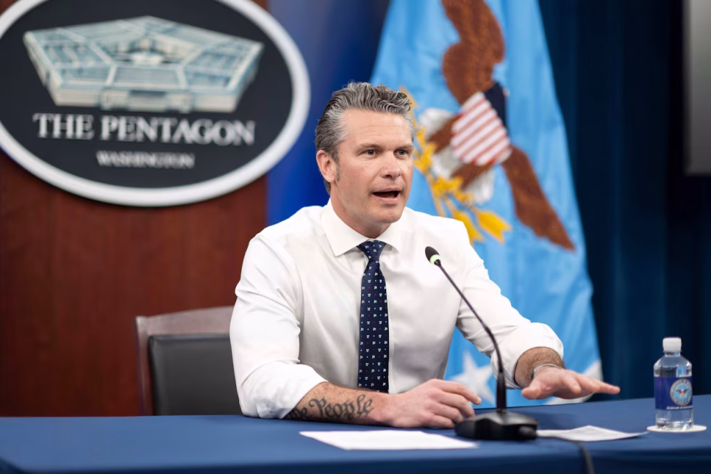 Defense Secretary Pete Hegseth hosts a teleconference with NFL players Aaron Jones and Elijah Higgins during their visit to the 386th Air Expeditionary Wing in Kuwait from the Pentagon, April 2, 2025.