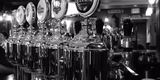photo of black and white, restaurant, bar, beverage, drink, nightlife, club, black, monochrome, drum, beer, alcohol, booze, faucet, drums, drummer, draught, pub, tavern, nightclub, pint, draft beer, beer tap