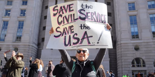 Independent public servants are a prerequisite for a functioning democracy. Photo from a protest outside the USAID HQ.
