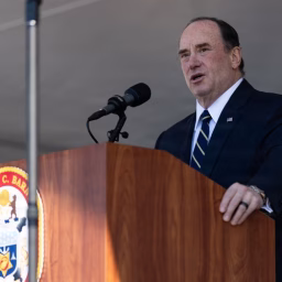 The 79th Secretary of the Navy, the Honorable John C. Phelan, delivers a speech during the USS Harvey C. Barnum Jr. ship commissioning at Naval Station Norfolk, Virginia, April 11, 2026.