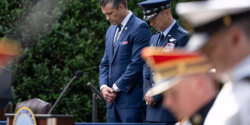 Secretary of War Pete Hegseth and Chairman of the Joints Chiefs of Staff U.S. Air Force Gen. Dan Caine bow their head in prayer during the 24th 9/11 Pentagon Observance Ceremony at the Pentagon, Washington, D.C., Sept. 11, 2025.