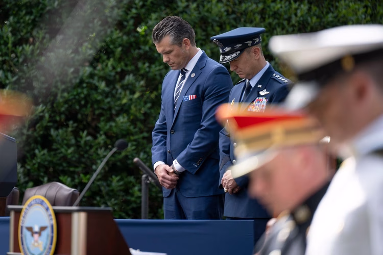 Secretary of War Pete Hegseth and Chairman of the Joints Chiefs of Staff U.S. Air Force Gen. Dan Caine bow their head in prayer during the 24th 9/11 Pentagon Observance Ceremony at the Pentagon, Washington, D.C., Sept. 11, 2025.